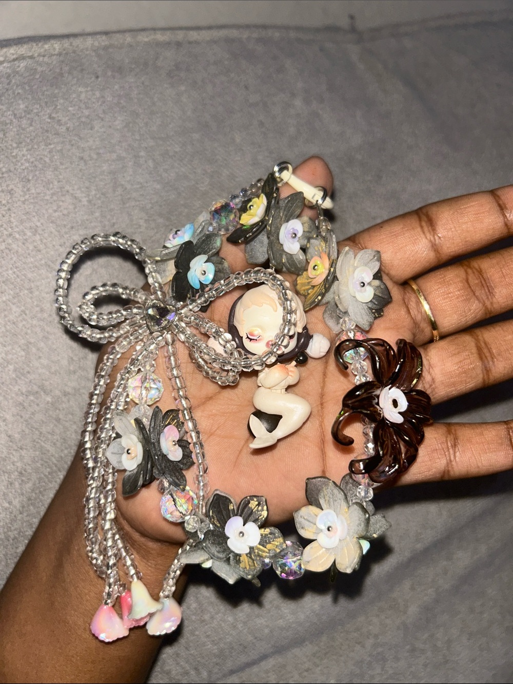 Handcrafted Floral Crystal bag Charm with Baby Figurine